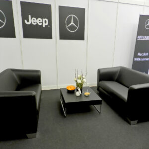 Rent a black sofa table for a trade fair